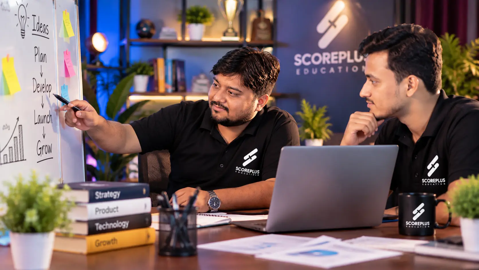 Scoreplus founders planning lessons together